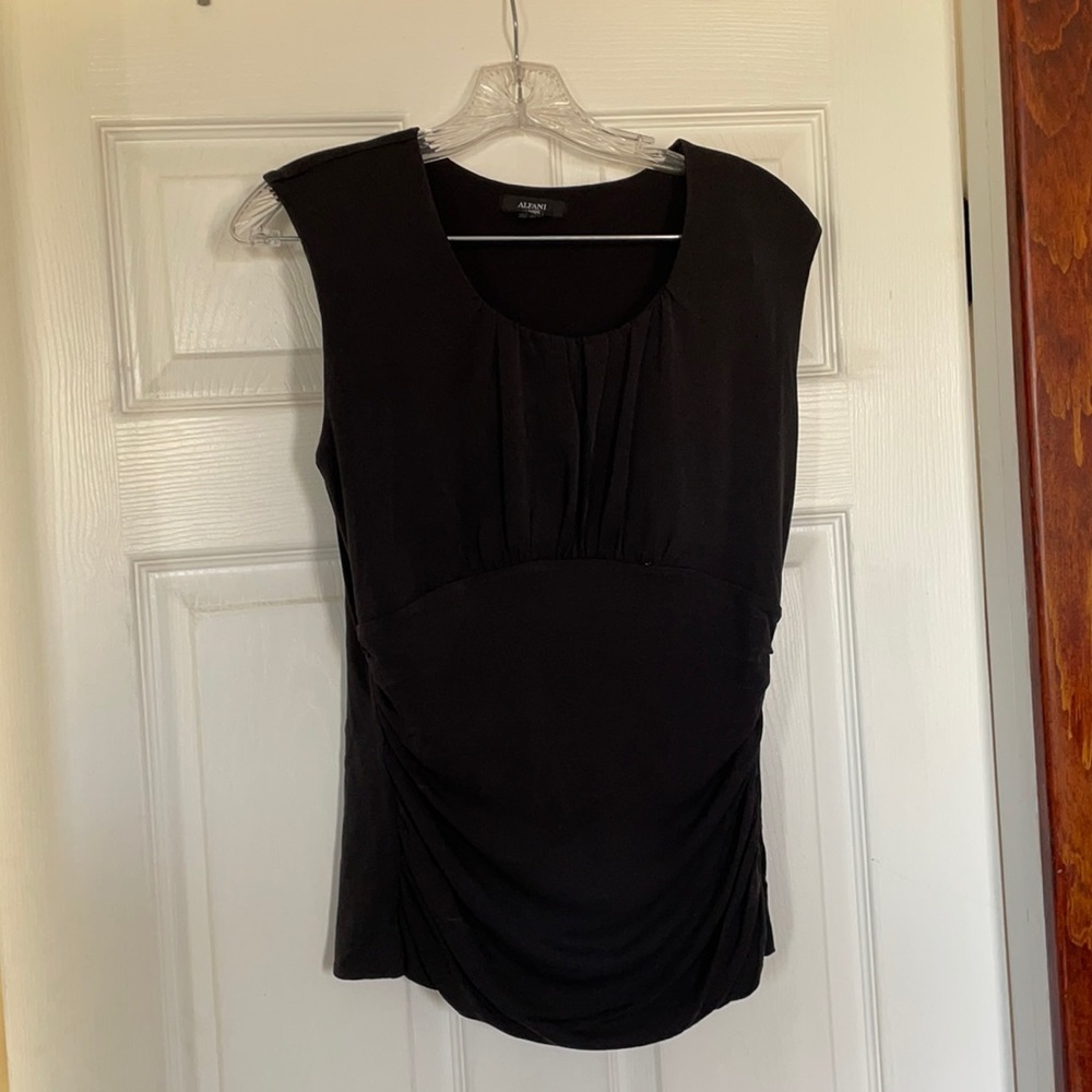 Black, ruched, sleeveless top.